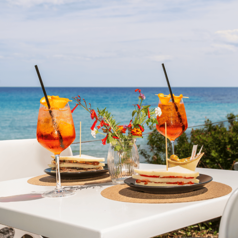Aperitivi vista mare Tortolì acQuachiara Porto Frailis piscina infinity tramonto
